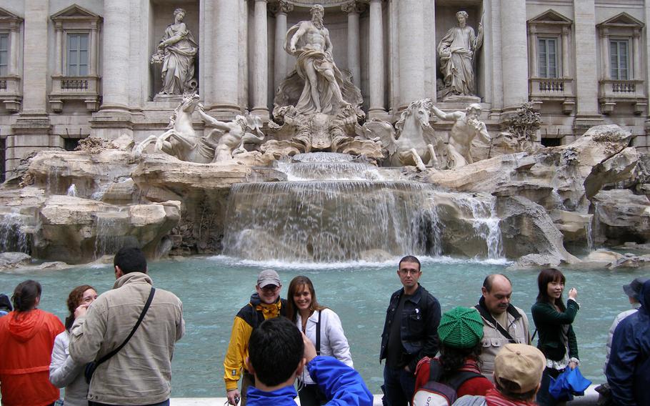 Tourists pose for photos in front of Rome's Trevi Fountain. The Islamic State group or its sympathizers have launched scores of attacks that killed hundreds and injured many more in France, Denmark, Germany, the United Kingdom, Belgium, Tunisia, Australia, Canada and the U.S., yet there have been no attacks in Italy.