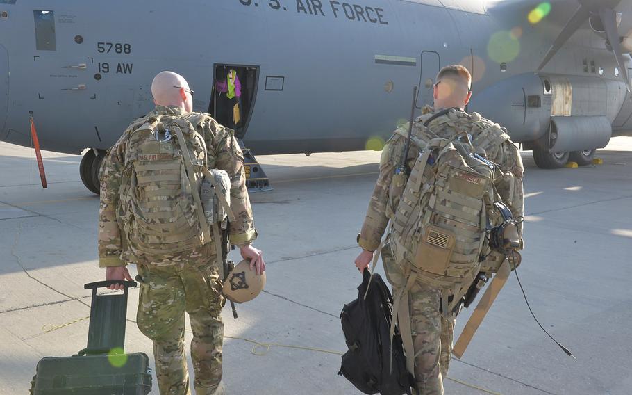 Airman 1st Class Jesse Johnson and Staff Sgt. Thomas Tyrone, members of the U.S. Air Force's Fly-Away Security Team at Bagram Air Field, Afghanistan, walk toward a C-130J Super Hercules on Sept. 23, 2016. The team provides security on board and on the flight line at high-risk airfields or when there is a risk of hijacking.