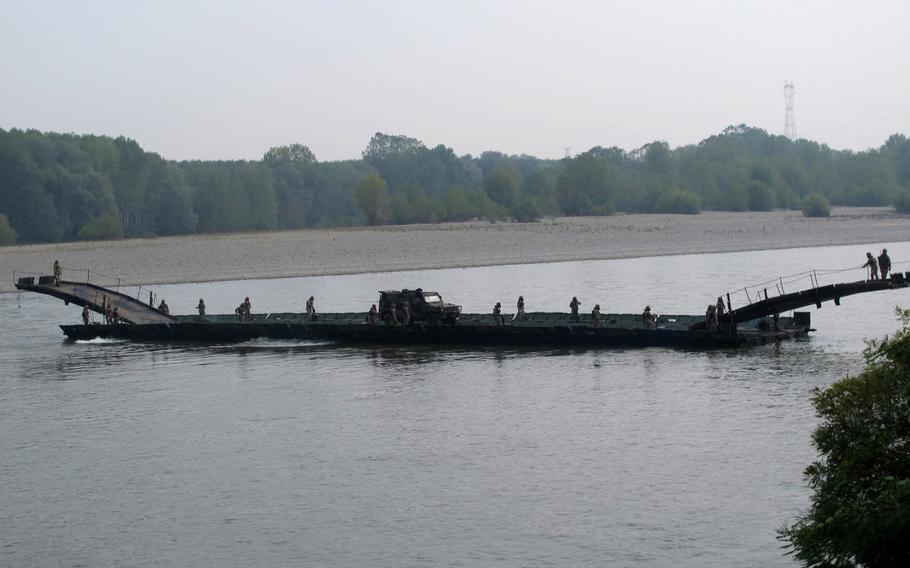 A motorized pontoon bridge built by Italian army engineers during an exercise with the 173rd Airborne Brigade on Oct. 18, 2016, demonstrates its ability to be used as a ferry.