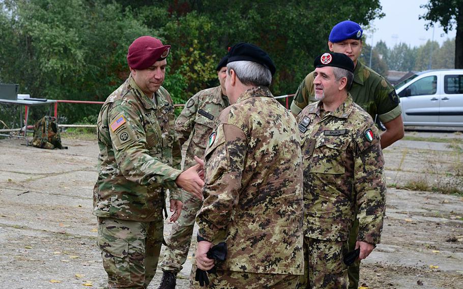 Col. Ben Bennett and Italian and Norwegian army officers meet on Monday, Oct. 17, 2016, on the Po River in northern Italy during a ''shock'' exercise that included a river crossing.