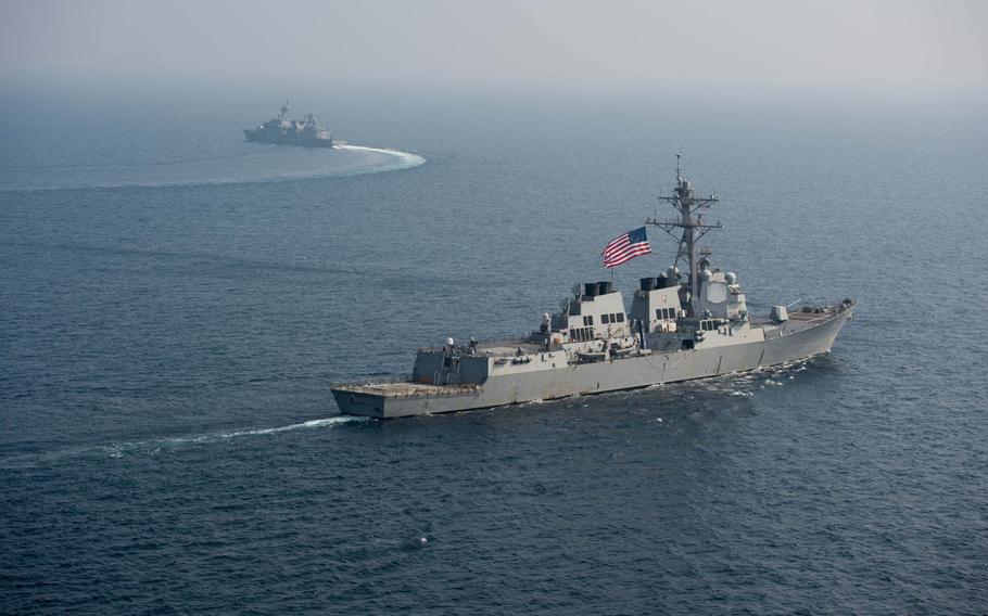 The destroyer USS McCampbell sails with a South Korean ship in waters off the Korean Peninsula on Oct. 15, 2016. The McCampbell will join Japanese and South Korean forces Oct. 22-23 in an exercise focused on detecting and stopping ships carrying weapons of mass destruction.