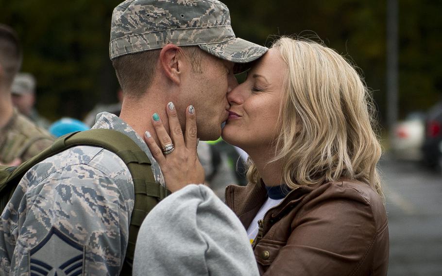 Master Sgt. Jonathan Grunow, left, and his wife Miranda Grunow embrace at Spangdahlem Air Base, Germany, on Thursday, Oct. 20, 2016. Grunow just got back from a six-month long deployment to Southwest Asia with the 606th Aircraft Control Squadron.
