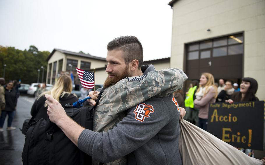 Michael Dittman, right, hugs his brother, Master Sgt. Matthew Dittman, at Spangdahlem Air Base, Germany, on Thursday, Oct. 20, 2016. Dittman took care of his two nephews while his brother and sister-in-law were deployed.