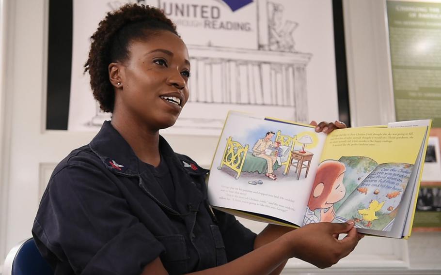 Petty Officer 1st Class Chardae Longshore, deployed to the Middle East onboard USS Dwight D. Eisenhower, is video-recorded reading a bedtime story for her son back home. Longshore was participating in a program called United Through Reading, which allows deployed parents to record these stories and have the DVDs sent home to their families.