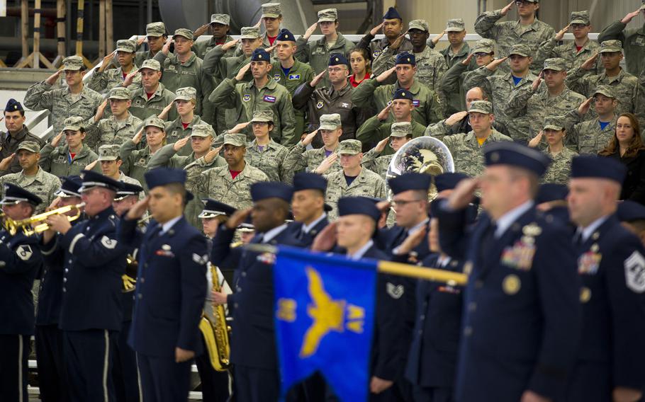 A formation and attendees salute during the Third Air Force change-of-command ceremony at Ramstein Air Base, Germany, on Friday, Oct. 21, 2016. Lt. Gen. Clark assumed command of the Third Air Force at the ceremony.