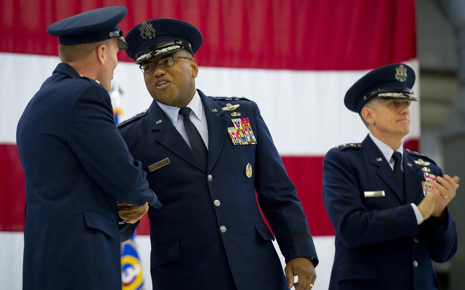 Lt. Gen. Richard Clark, center, shakes hands with Gen. Tod Wolters, U.S. Air Forces in Europe and Africa commander, after assuming command of the Third Air Force at Ramstein Air Base, Germany, on Friday, Oct. 21, 2016.