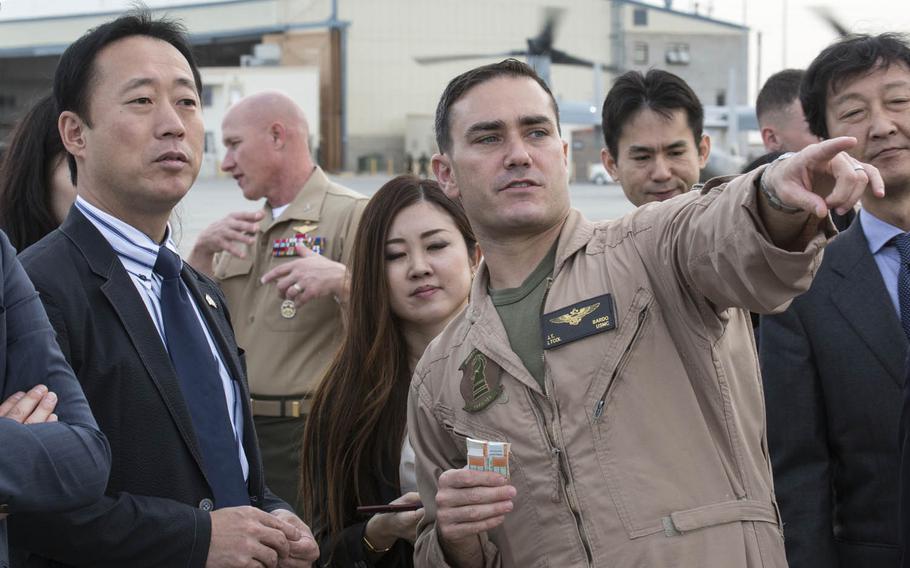 Marine Corps Lt. Col J. T. Bardo, right, points out information to Yoshihiko Fukuda, left, mayor of Iwakuni, Japan, while observing an F-35B Lightning II at Marine Corps Air Station Yuma, Ariz., Monday Oct. 24, 2016. The F-35B boasts a short takeoff and vertical landing capabilities.