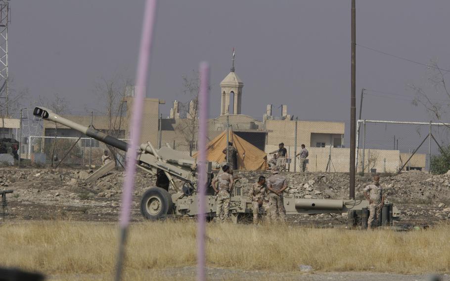 Iraqi troops man artillery pieces in Bartella - a liberated Christian village near Mosul, Iraq, on Wednesday, Oct.26, 2016.