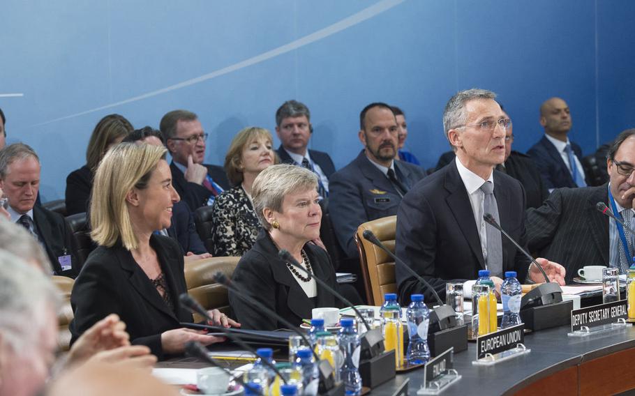 NATO Secretary-General Jens Stoltenberg, second from right, delivers opening remarks on the second and final day of a defense ministers meeting at the alliance's headquarters in Brussels, Belgium, on Thursday, Oct. 27, 2016. European Union High Representative for Foreign Affairs Federica Mogherini, left, and NATO Deputy Secretary-General Rose Gottemoeller, second from left, listen.