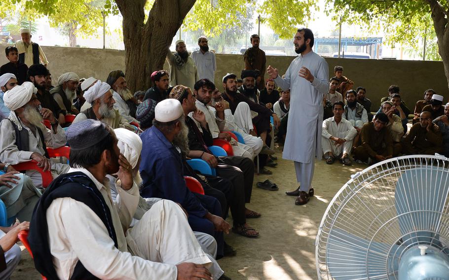 Afghan refugees repatriating from Pakistan are briefed on various issues at the Samarkhel Encashment Center outside Jalalabad, Afghanistan, on Thursday, Oct. 6, 2016.