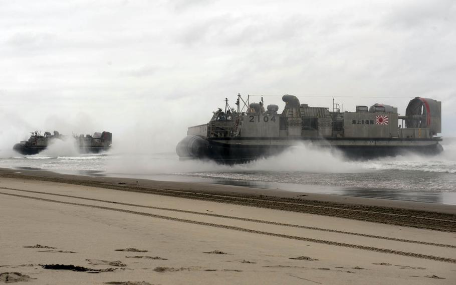 The Japan Maritime Self-Defense Force and U.S. Navy simulate a beach-front assault during a past Dawn Blitz exercise at Camp Pendleton, Calif. Japan plans to activate its 2,100-member Amphibious Rapid Deployment Brigade by March 2018.