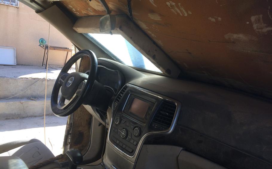 The interior of an abandoned Islamic State SUV covered with bolt-on armored plates, pictured on Wednesday, Nov. 2, 2016. The bizarre vehicle is an example of the homemade weapons that fleeing Islamic State militants left on the battlefield at the village of Kermlis, near Mosul.