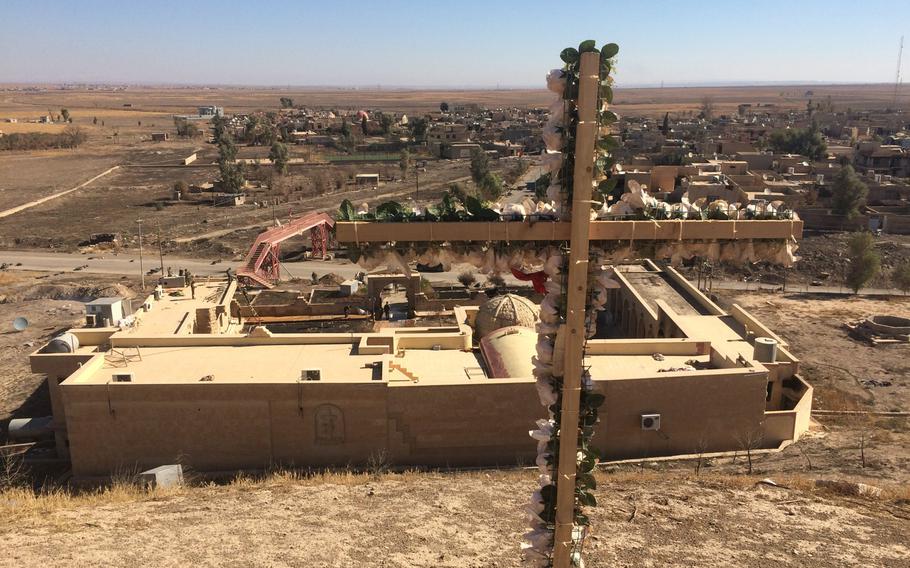 The Islamic State group dug a network of tunnel beneath the village of Kermlis, east of Mosul, Iraq's second-largest city. The village is seen from the top of a hill behind the St. Barbara Church on Wednesday, Nov. 2, 2016.