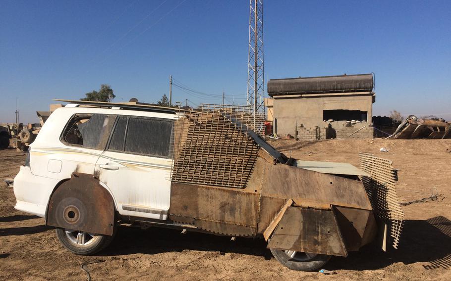 An abandoned Islamic State SUV with its front half clad in steel plates on Wednesday, Nov. 2, 2016. The strange vehicle is an example of the improvised weapons that Islamic State militants left on the battlefield at the village of Kermlis, near Mosul.