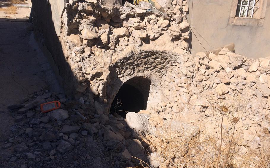 Entrance of a tunnel dug by Islamic State militants in the village of Kermlis, east of Mosul, Iraq, on Wednesday, Nov. 2, 2016.