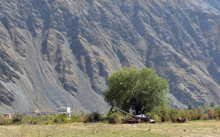A cow grazes near a Soviet tank, one of many derelict pieces of military hardware littering the now-peaceful Panjshir Valley in central Afghanistan on Oct. 13, 2016. The valley was a guerilla stronghold during the Soviet invasion of Afghanistan in the 1980s.