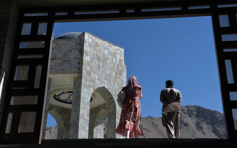 Visitors approach the tomb of Ahmad Shah Massoud near the town of Bazarak in central Afghanistan's Panjshir Valley on Oct. 13, 2016.