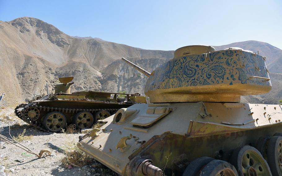 A derelict tank, pictured here on Oct. 13, 2016, has been painted gold and its turret decorated with blue paisley designs on a hilltop where Afghan mujahedeen leader Ahmed Shah Massoud is entombed near the town of Bazarak.