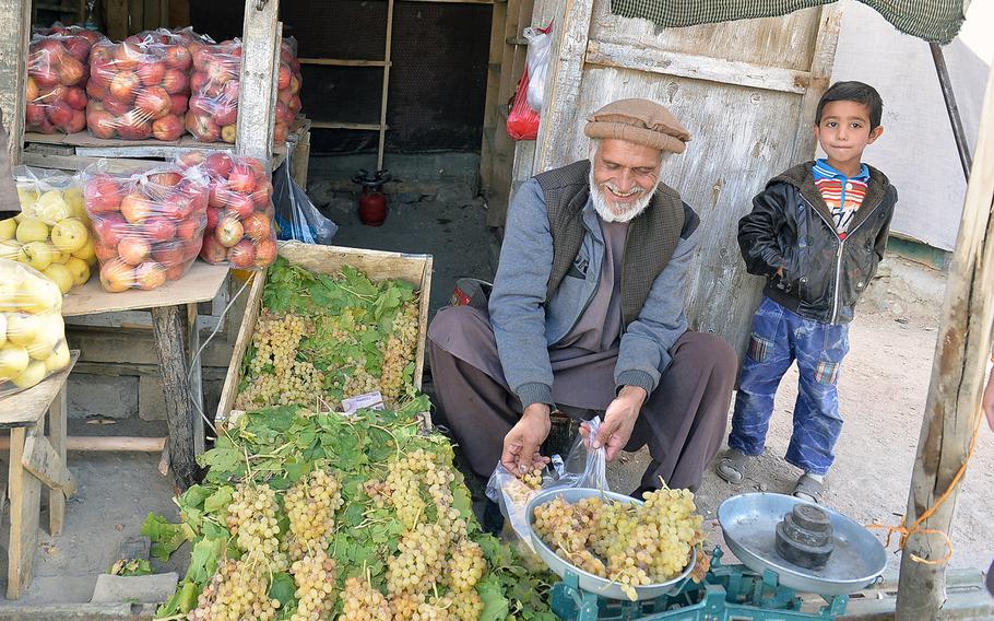 Panjshir Valley resident Abdul Ghani is pictured on Oct. 13, 2016, at his fruit stand in the town of Bazarak. He said the valley remains secure, but the people of the area are alert to violence elsewhere in the country, which they fear could arrive in their villages, too.