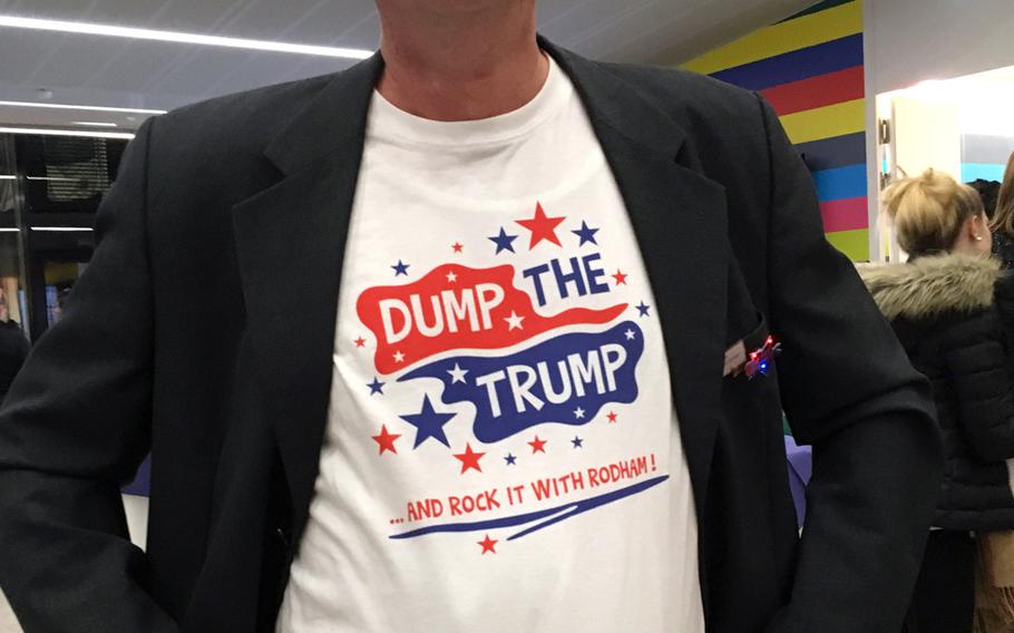 Ralf Eichert dons a homemade anti-Trump shirt during an election party in Stuttgart, where about 300 people gathered on Tuesday, Nov. 8, 2016.