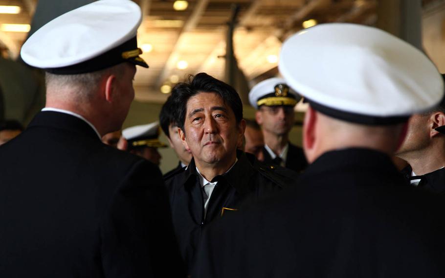Japanese Prime Minister Shinzo Abe vists the USS Ronald Reagan, the Navy's only forward-deployed aircraft carrier, Oct. 18, 2015. In a letter to Donald Trump this week, Abe congratulated the United States' new president-elect and called him "a very successful businessman with extraordinary talents."