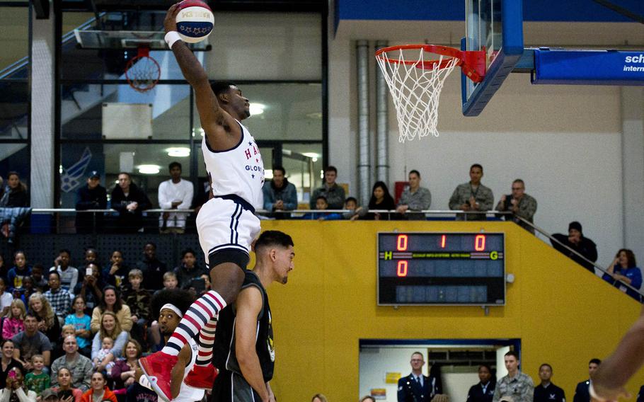 Harlem Globetrotter Ant Atkinson goes up for a dunk at Ramstein Air Base, Germany, on Thursday, Nov. 10, 2016.