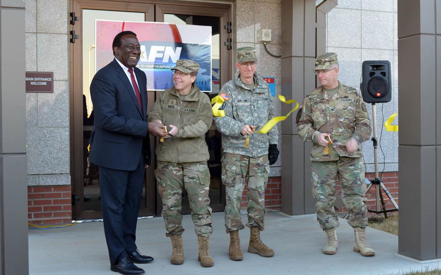 From left to right: Ray Shepherd, Defense Media Activity director; Brig. Gen. Tammy Smith, 8th Army deputy commanding general for sustainment; Maj. Gen. James Walton, U.S. Forces Korea director of transformation and restationing; and Col. Joseph Holland, Camp Humphreys garrison commander; take part in a ribbon-cutting ceremony, Tuesday, Nov. 15, 2016, to mark the grand opening of American Forces Network Pacific Korea's new headquarters at Humphreys.