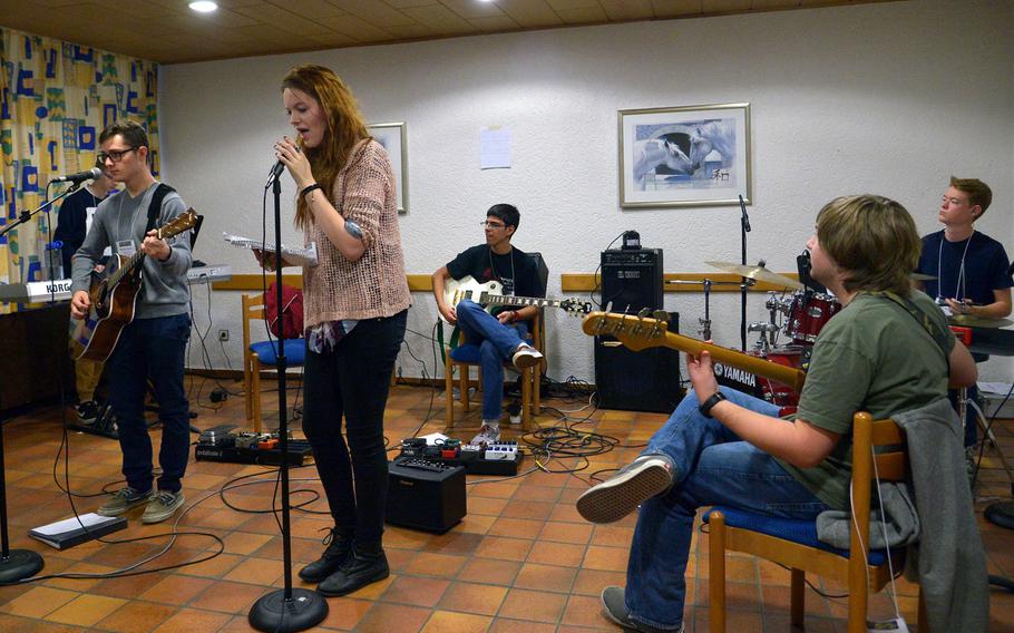 A group in the garage band workshop at this year's Creative Connections rehearses a song, Tuesday, Nov. 15, 2016. Creative Connections, is a weeklong DODEA-Europe symposium for high school students featuring ten workshops in the visual and performing arts.