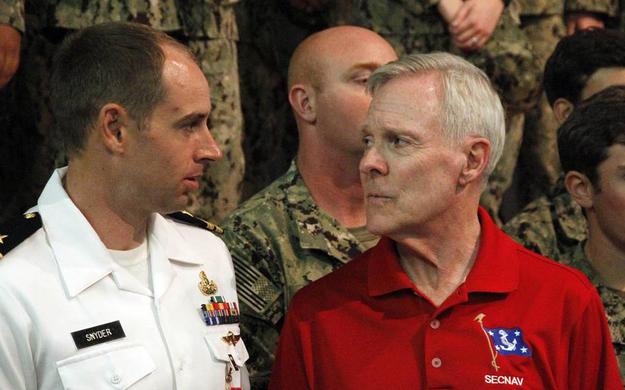 Secretary of Navy Ray Mabus, right, stands beside Lt. Mark Snyder, who was presented the Bronze Star at Joint Base Pearl Harbor-Hickam, Hawaii, Wednesday, Nov. 16, 2016. Mabus is on an around-the-world trip, perhaps his last before retiring in January after seven years in the position.