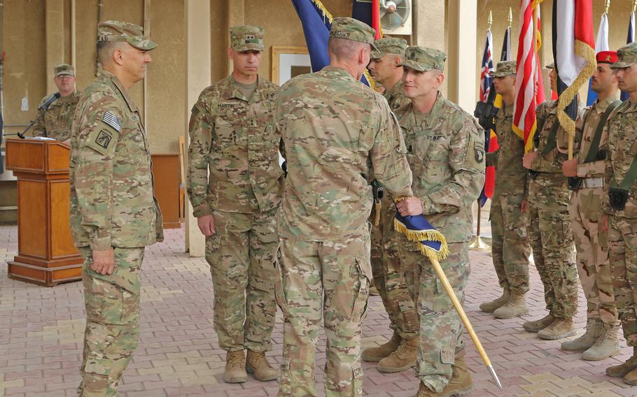 The 101st Airborne Division's Command Sgt. Maj. Gregory Nowak and outgoing commander of the  Combined Joint Forces Land Component Command, Maj. Gen. Gary Volesky, during the transfer of authority ceremony on Nov. 17, 2016, in Baghdad, Iraq. The ceremony marked the end of the division's nine-month deployment.