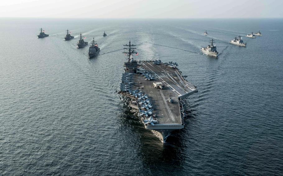 The USS Ronald Reagan steams in formation last month with ships from Carrier Strike Group Five and the South Korean navy during Exercise Invincible Spirit.
