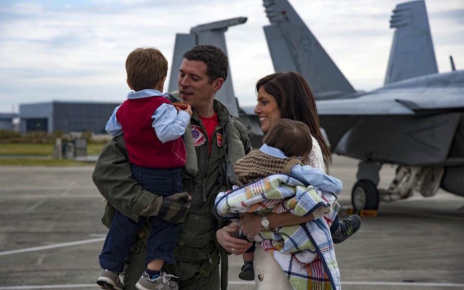 Lt. Cmdr. Chris Keen, a pilot assigned to Carrier Air Wing 5, is greeted by his family at Naval Air Facility Atsugi, Nov. 16, 2016. Keen, along with other pilots from Carrier Air Wing 5, returned home to Atsugi upon the completion of a patrol with the aircraft carrier USS Ronald Reagan.