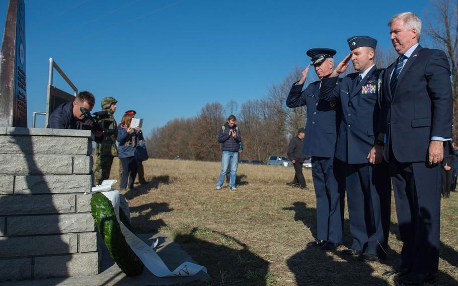 Kyle Scott, U.S ambassador to Serbia, right, Lt. Col. Todd Andrewsen and Brig. Gen. Randy Huston, left, present a wreath at the Operation Halyard memorial in Pranjani, Serbia, Thursday, Nov. 17, 2016. Officials from the State Department, the U.S. Air Force, the Royal Air Force and the Serbian armed forces commemorated the actions of Serbs to rescue more than 500 Allied airmen who were shot down over Serbia during World War II.