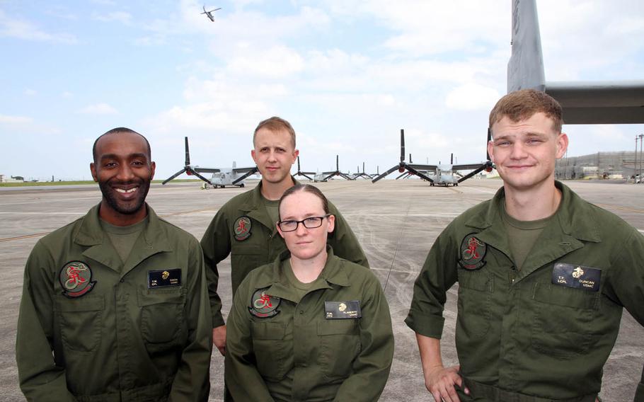 An MV-22 Osprey maintenance team poses at Marine Corps Air Station Futenma, Okinawa, earlier this month while preparing for a long-range raid as part of Exercise Blue Chromite 2017. From left to right are: Cpl. Tyler Simon, Lance Cpl. Eric Brundy, Private 1st Class Eilis Flaherty and Lance Cpl. Taegen Todd Duncan.