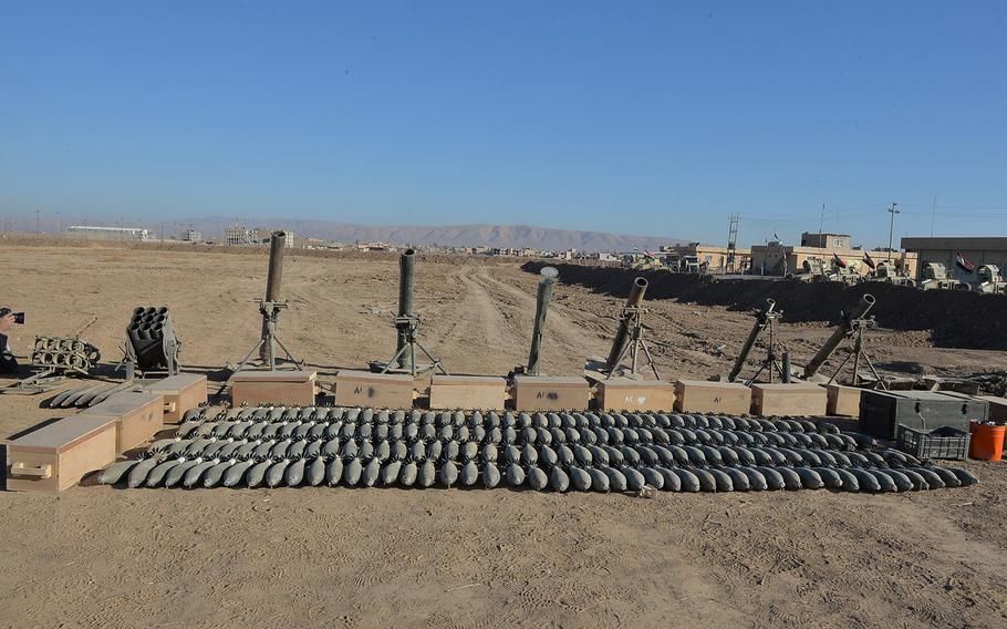 Mortar shells and mortar tubes Iraqi forces have seized from Islamic State fighters in villages outside Mosul are lined up outside a camp for the army's 9th armored division in Karamlis, pictured here on Saturday, Nov. 19, 2016.