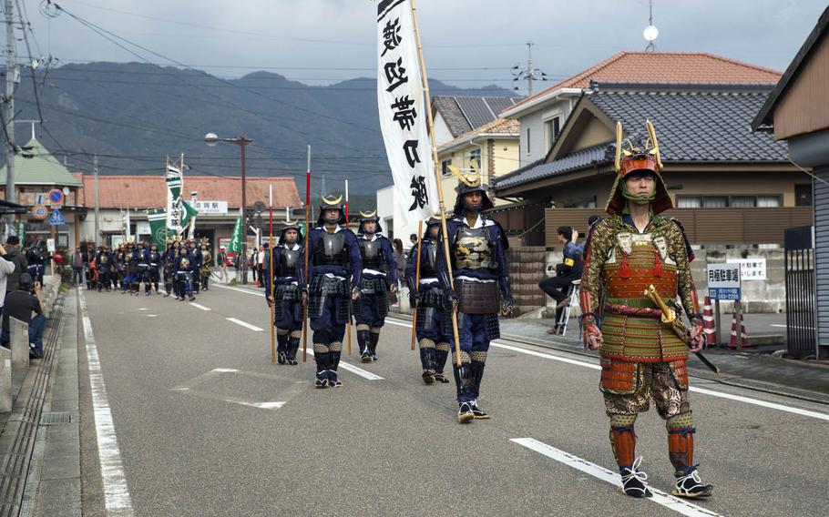 Samurai march during the 27th-annual Kuragake Festival and Samurai March in Iwakuni City, Japan, Sunday, Nov. 20, 2016. Marines from Marine Corps Air Station Iwakuni joined the locals in transforming into samurai warriors to march in the parade, commemorating their great battle of 1555.