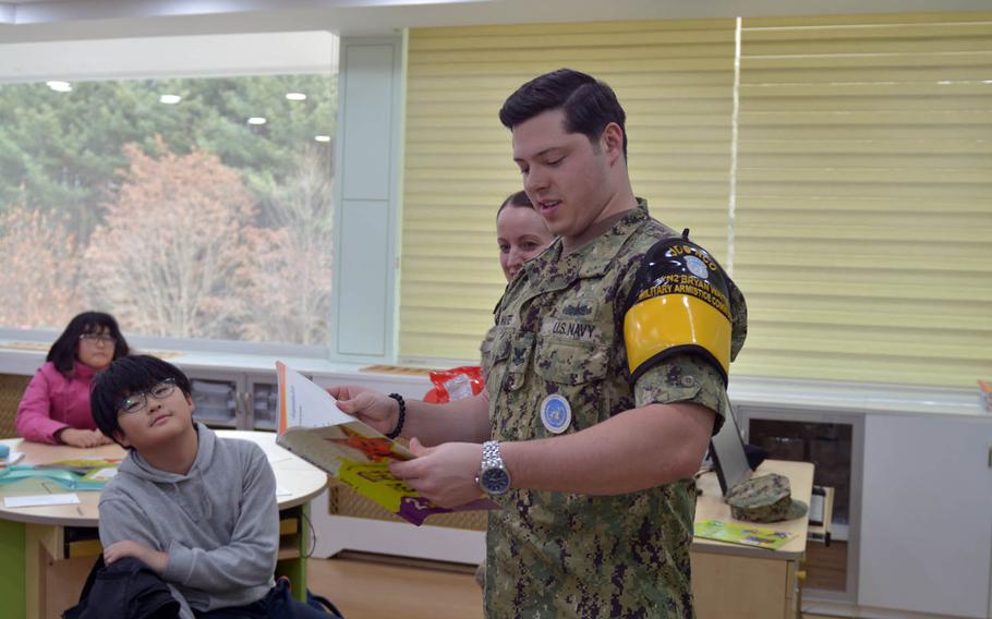 Navy Petty Officer 2nd Class Bryan Waite and New Zealand Capt. Sara Tuapawa, who both work with the U.N. Command Military Armistice Commission in the Demilitarized Zone, teach an English class at the Taesong-dong Elementary School on Tuesday, Nov. 22, 2016. The school is in the village of the same name, just about a mile from its North Korean equivalent called Kijong-dong. The North Korean side is believed to be largely vacant but plays loud propaganda broadcasts that can be heard across the border day and night. Residents of Taesong-dong enjoy many benefits in exchange for living in the dangerous area because the government considers it an important symbol.