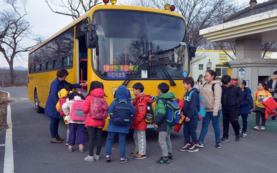 South Korean children who study at Taesong-dong Elementary School board a bus after classes on Tuesday, Nov. 22, 2016. The school is in the village of the same name, just about a mile from its North Korean equivalent called Kijong-dong. The North Korean side is believed to be largely vacant but plays loud propaganda broadcasts that can be heard across the border day and night.