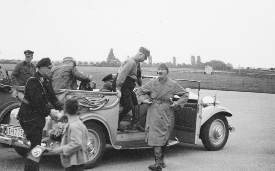 In this photo from the book "The Bombing of Wiesbaden, 1941-1945," by Thomas Weichel, Adolf Hitler arrives at Erbenheim airfield on July 29, 1932, as part of his "Hitler over Germany" campaign. The airfield was later used by German fighter planes during World War II and is now part of U.S. Army Europe's Clay Kaserne.
