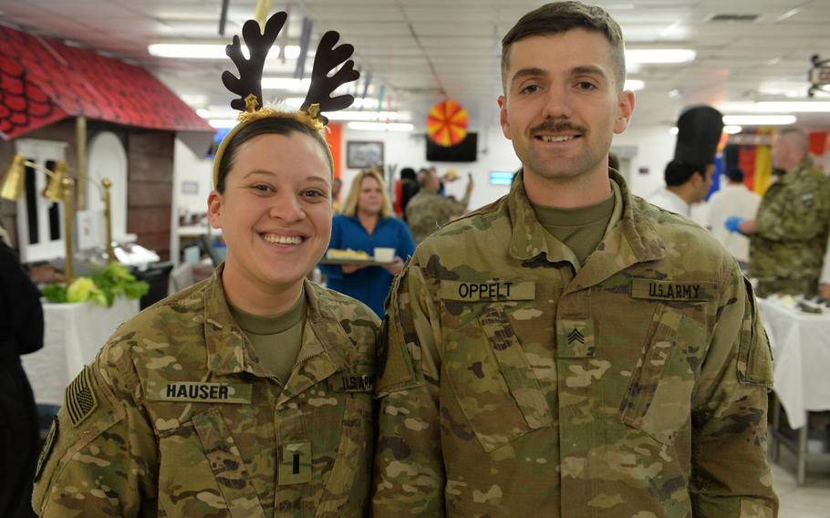 Army 1st Lt. Susanne Hauser, left, and Army Sgt. Kevin Oppelt spend their first Thanksgiving away from home at NATO's Resolute Support headquarters in Kabul, Afghanistan, on Thursday, Nov. 24, 2016.