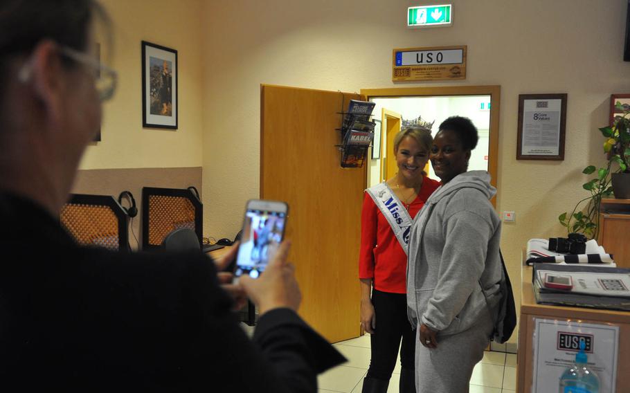 Army Sgt. 1st Class Lydwina Robinson gets her photo taken with Miss America 2017 Savvy Shields at the USO Warrior Center at Landstuhl Regional Medical Center, Germany on Friday, Nov. 25, 2016. 