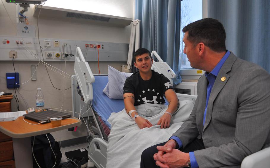 Patrick Murphy, under secretary of the Army, visits with Army Cpl. Kayla Aninion at Landstuhl Regional Medical Center, Germany, on Nov. 25, 2016. 