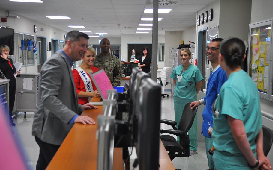 Patrick Murphy, under secretary of the Army, and Savvy Shields, Miss America 2017, share a laugh with staff members in the Intensive Care Unit at Landstuhl Regional Medical Center, Germany on Friday, Nov. 25, 2016. 

Jennifer H. Svan/Stars and Stripes