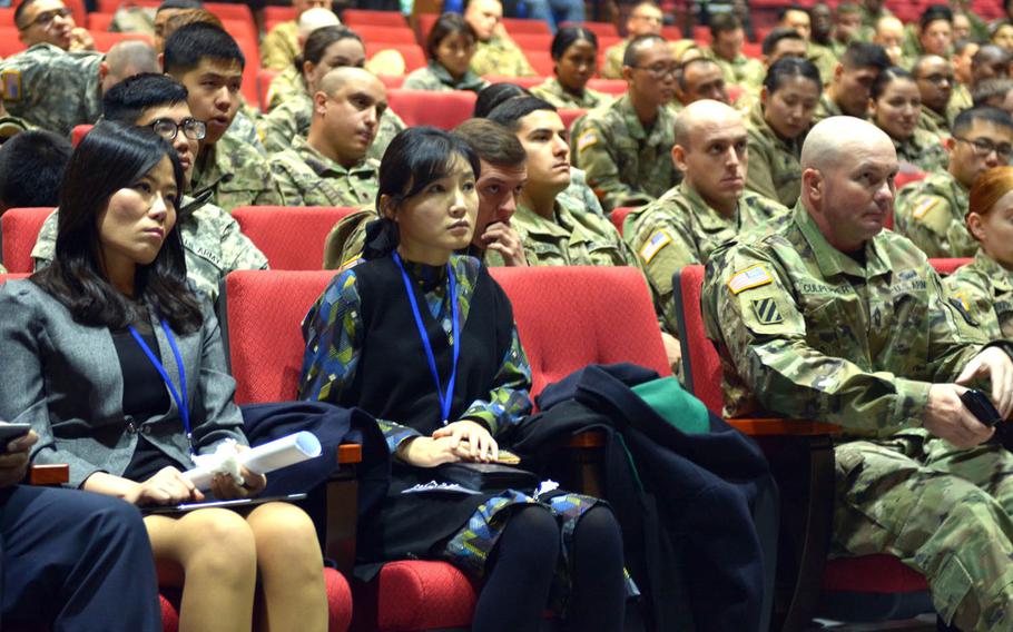 North Korean defectors Sera Kim, left, and Yang So Hyen listen as a colleague speaks during an event where defectors shared their stories with soldiers from the 52nd Air Defense Artillery Regiment assigned to the 35th Air Defense Artillery Brigade at Suwon Air Base, South Korea, Friday, Dec. 2, 2016.
