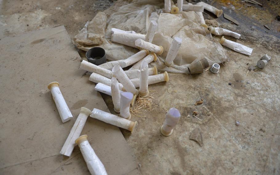 These 12-gauge primers, pictured here on the floor of a church building in Qaraqosh, Iraq, near Mosul, appear to have been modified by Islamic State munitions makers for use as mortar ignition charges, pictured on Dec. 17, 2016. Researchers believe the militants may have produced tens of thousands of rockets and mortars using sophisticated industrial processes.