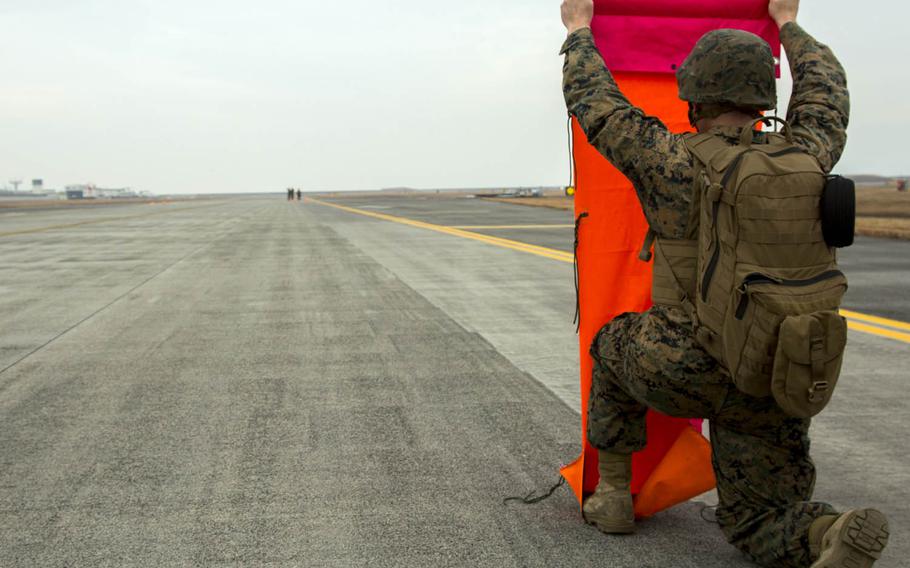 Marines establish an expeditionary airfield during aircraft landing zone training at Marine Corps Air Station Iwakuni, Japan, in late December.