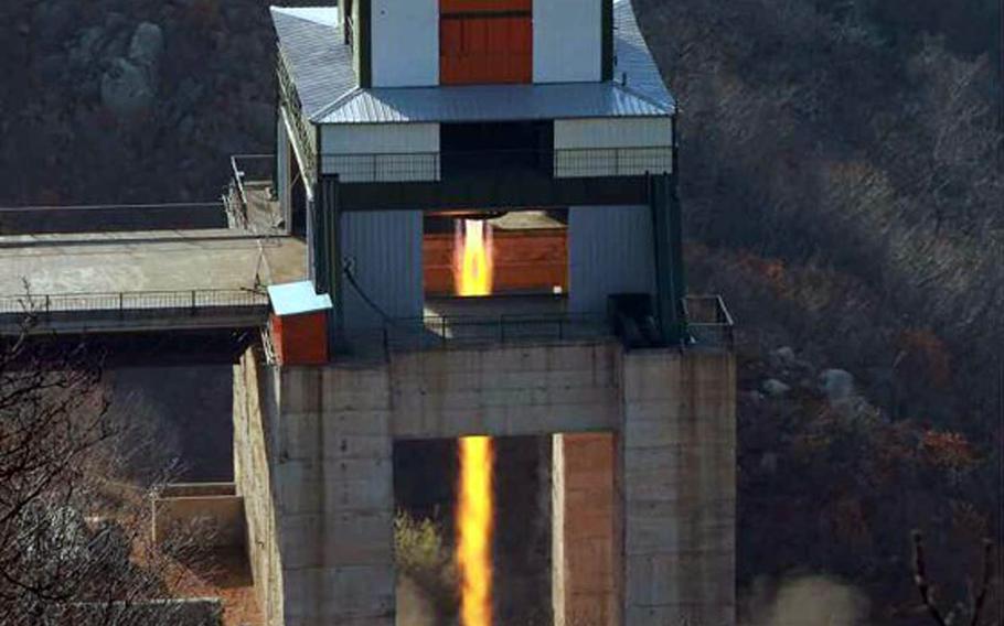 This undated photo from North Korea's Korean Central News Agency purports to show an engine test for an intercontinental ballistic missile at the communist nation's Sohae rocket-launching site.