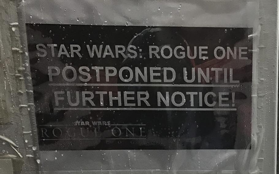 A sign at the dining facility on a coalition base at Irbil International Airport, pictured here on Sunday, Dec. 25, 2016, informs servicemembers that special showings of the latest ''Star Wars'' film, ''Rogue One,'' would be postponed indefinitely. Operational and weather conditions delayed the screening in Irbil.