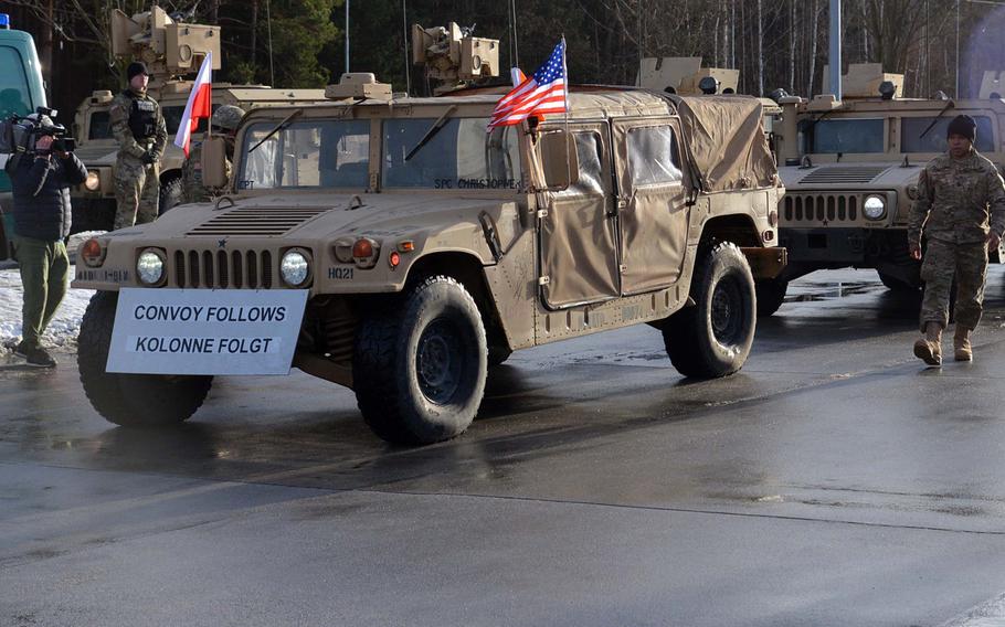 A Humvee of the 3rd Armored Brigade Combat Team, 4th Infantry Division, flies the Polish and American flags after crossing the German-Polish border near Olszyna, on its way to Zagan, Poland, Thursday, Jan. 12, 2017.