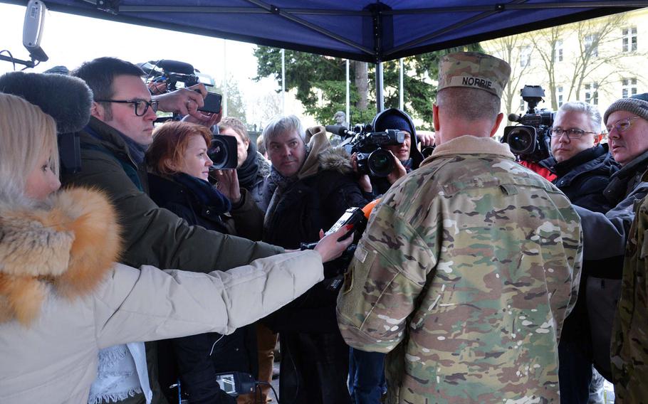 Journalists surround Col. Christopher Norrie, 3rd Armored Brigade Combat Team, 4th Infantry Division, commander, after a welcoming ceremony for his unit in Zagan, Poland. The unit is on a nine-month deployment to eastern Europe as part of Operation Atlantic Resolve.